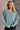 Front view of model wearing the Parker Sea Foam Textured Knit Long Sleeve Sweater which features seafoam textured knit fabric, ribbed hem, round neckline, dropped shoulders and long balloon sleves with cuffs.