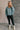 Full body view of model wearing the Parker Sea Foam Textured Knit Long Sleeve Sweater which features seafoam textured knit fabric, ribbed hem, round neckline, dropped shoulders and long balloon sleves with cuffs.