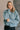 Front view of model wearing the Parker Sea Foam Textured Knit Long Sleeve Sweater which features seafoam textured knit fabric, ribbed hem, round neckline, dropped shoulders and long balloon sleves with cuffs.