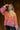 Front view of model wearign The Madison Multi Colored Boho Sweater features beige, yellow, orange and purple knit fabric, loose turtleneck neckline, dropped shoulders and long balloon sleeves.