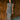 Full body front view of model wearing the Alianna Silver Shimmer Cowl Neck Midi Dress that has grey and silver shimmer fabric, midi length, ruched side details, a slit on the side, a slight cowl high neckline, and a sleeveless design.