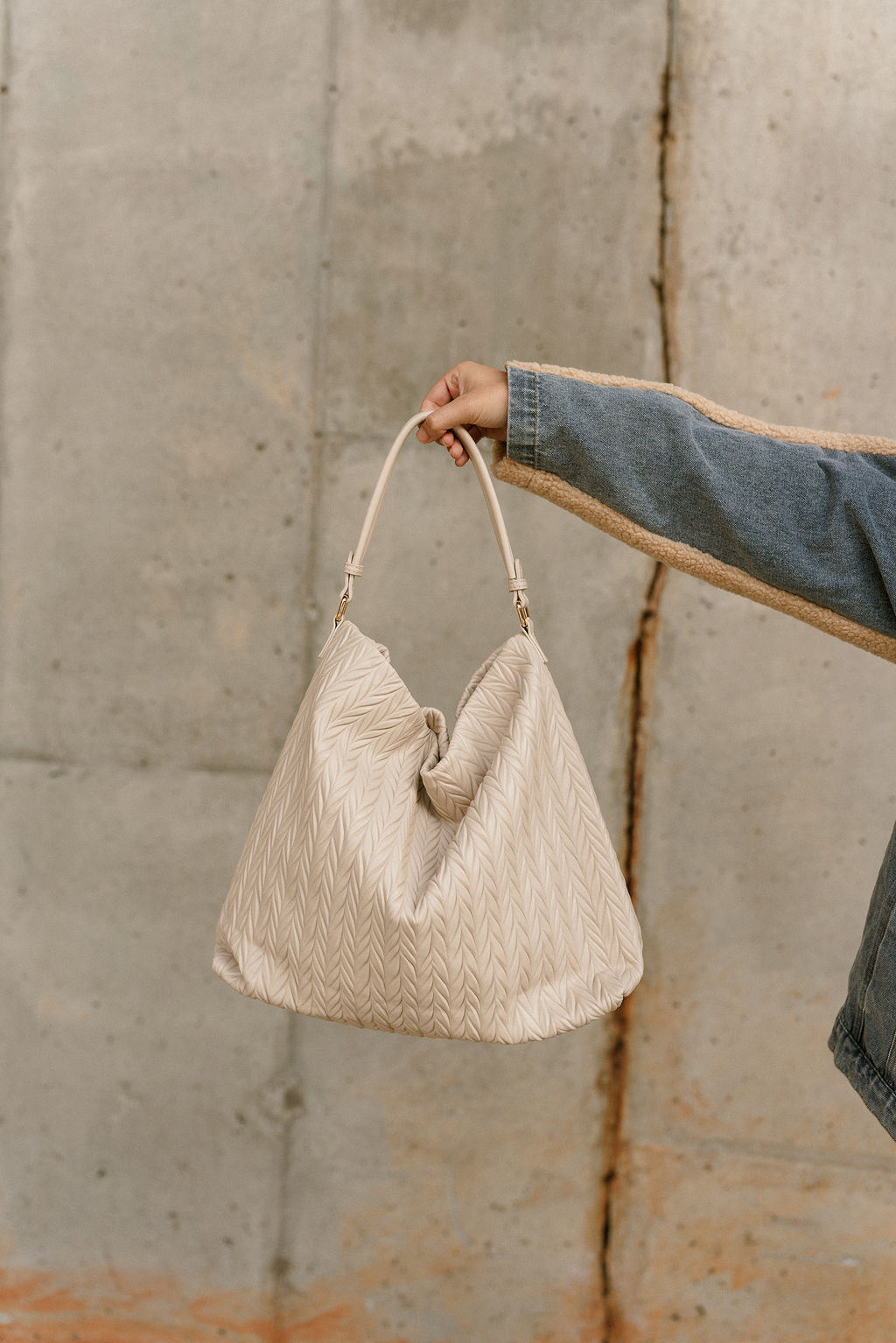 Harley Ribbed Shoulder Strap Purse-cream-held by model