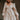 Front view of model wearing the Stella Beige Long Sleeve Mini Dress which features beige lightweight fabric, mini length, flared skirt, beige lining, sweetheart neckline, ruffle details, long sleeves with elastic wrists and smocked back.