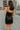 Back view of model wearing the Brielle Black Sequin Fringe Mini Dress which features black sheer fabric, black lining, mini length, black sequin fringe details, scooped neckline, adjustable straps, sleeveless and monochrome back zippper with hook closure.