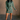 Full body view of model wearing the Sasha Grey Green Mock Neck Sweater Dress which features grey green textured knit fabric, a thick ribbed hem, mini length, a high ribbed neckline, and long sleeves with ribbed cuffs.