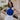  front view of model wearing The Primrose Halter Tank in cobalt blue. This tank has ribbed fabric and a halter cross strap neckline.