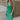 Front view of model wearing the Make You Mine Midi Dress that has green plisse fabric, a midi-length hem, a v neck, thick straps, a sleeveless body, and a back zipper with a hook closure.