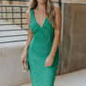 Front view of model wearing the Make You Mine Midi Dress that has green plisse fabric, a midi-length hem, a v neck, thick straps, a sleeveless body, and a back zipper with a hook closure.