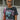 Front view of model wearing the Bob Dylan Cropped Graphic Tee, which features charcoal knit fabric, a round neckline, and short sleeves.