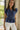 Bellamy Navy Peplum Ruffle Sleeveless Top- frontal side view