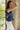 Bellamy Navy Peplum Ruffle Sleeveless Top- view of side