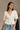 Dahlia White Stitch Lace V-Neckline Top- front view