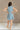 Avery Washed Denim Fray Mini Dress- full body back view