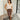 Full body front view of model wearing the Trouble Maker Pleather Midi Skirt that has dark brown faux leather, midi length, a slit, pockets, a front zipper, and belt loops