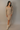 Full body view of model wearing the Adeline Khaki Ribbed Long Sleeve Midi Dress which features khaki ribbed fabric, midi length, slits on each side, a square neckline, and long sleeves.