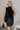 Front view of model wearing the Miley Black Rhinestone Faux Leather Mini Skirt which features black faux leather fabric, black lining, mini length, rhinestone embellishments, and a monochromatic side zipper with a hook closure.
