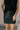 Front view of model wearing the Miley Black Rhinestone Faux Leather Mini Skirt which features black faux leather fabric, black lining, mini length, rhinestone embellishments, and a monochromatic side zipper with a hook closure.