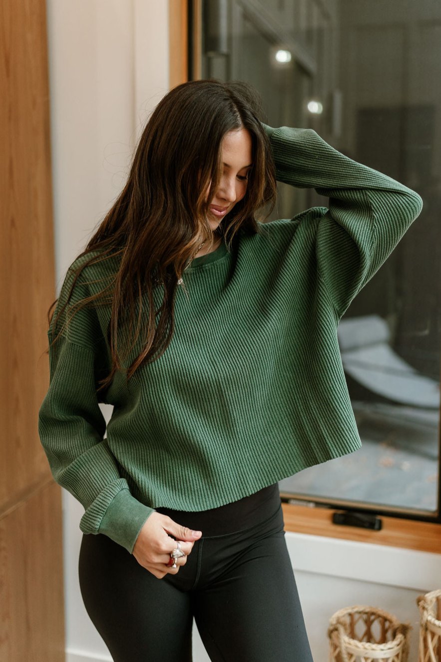 Rylie Dark Green Cropped Thermal Top - Front view (arm raised)