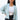 Front view of model wearing the Time Is Now Cardigan that has teal, white, and light green knit fabric with a stitched pattern, a button-up front, long sleeves, and a cropped waist. Worn unbuttoned over brami.