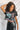 Front view of model wearing the Bob Dylan Cropped Graphic Tee, which features charcoal knit fabric, a round neckline, and short sleeves.