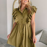 Frontal view of the Meet Your Match Dress that features a green colored material, a collar neckline, a button-up front, a ruffle sleeve, side pockets, and a mini length.