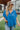 Frontal view of the Beach Dreams Oversized Top that features a hidden button up front with a collar, 3/4 length batwing sleeves, and a flowy fit with a high-low hemline.