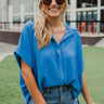 Frontal view of the Beach Dreams Oversized Top that features a hidden button up front with a collar, 3/4 length batwing sleeves, and a flowy fit with a high-low hemline.