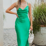 Frontal view of the Call You Mine Midi Dress In Green that features a green colored silk material, a cowl neckline, a sleeveless design with thin adjustable straps, a side slit, and a midi length.