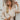 Frontal view of the On Your Mark Top that features a collared neckline, a monochromatic checkered print, long cuffed sleeves, a gold button-up front, and a high-low design.