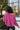 Back view of model waring The Blake Cropped Sweatshirt In Purple features knit fabric with a soft fleece interior, a round neckline, long batwing sleeves, and a wide cropped fit