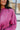 Front detail of model waring The Blake Cropped Sweatshirt In Purple features knit fabric with a soft fleece interior, a round neckline, long batwing sleeves, and a wide cropped fit