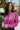 Front view of model waring The Blake Cropped Sweatshirt In Purple features knit fabric with a soft fleece interior, a round neckline, long batwing sleeves, and a wide cropped fit