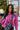 Front view of model waring The Blake Cropped Sweatshirt In Purple features knit fabric with a soft fleece interior, a round neckline, long batwing sleeves, and a wide cropped fit