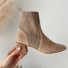 Side view of the Geraldine Sock Booties that have taupe suede with ribbed knit material, pull tabs, square toes, and 2" block heels.