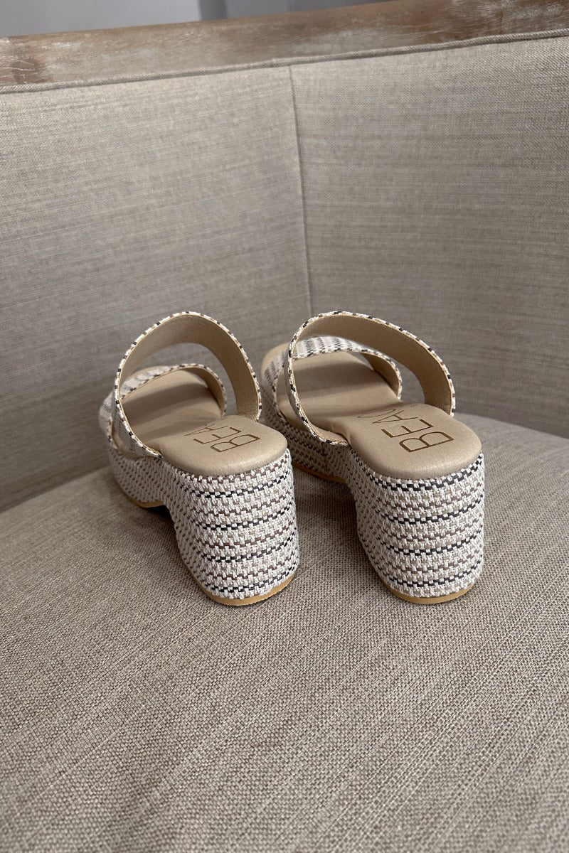 Back view of the Ocean Ave Platform Sandal in Ivory Mosaic which  features ivory, natural and brown knit fabric, two straps, slide-on style, monochrome platform sole and block heel.