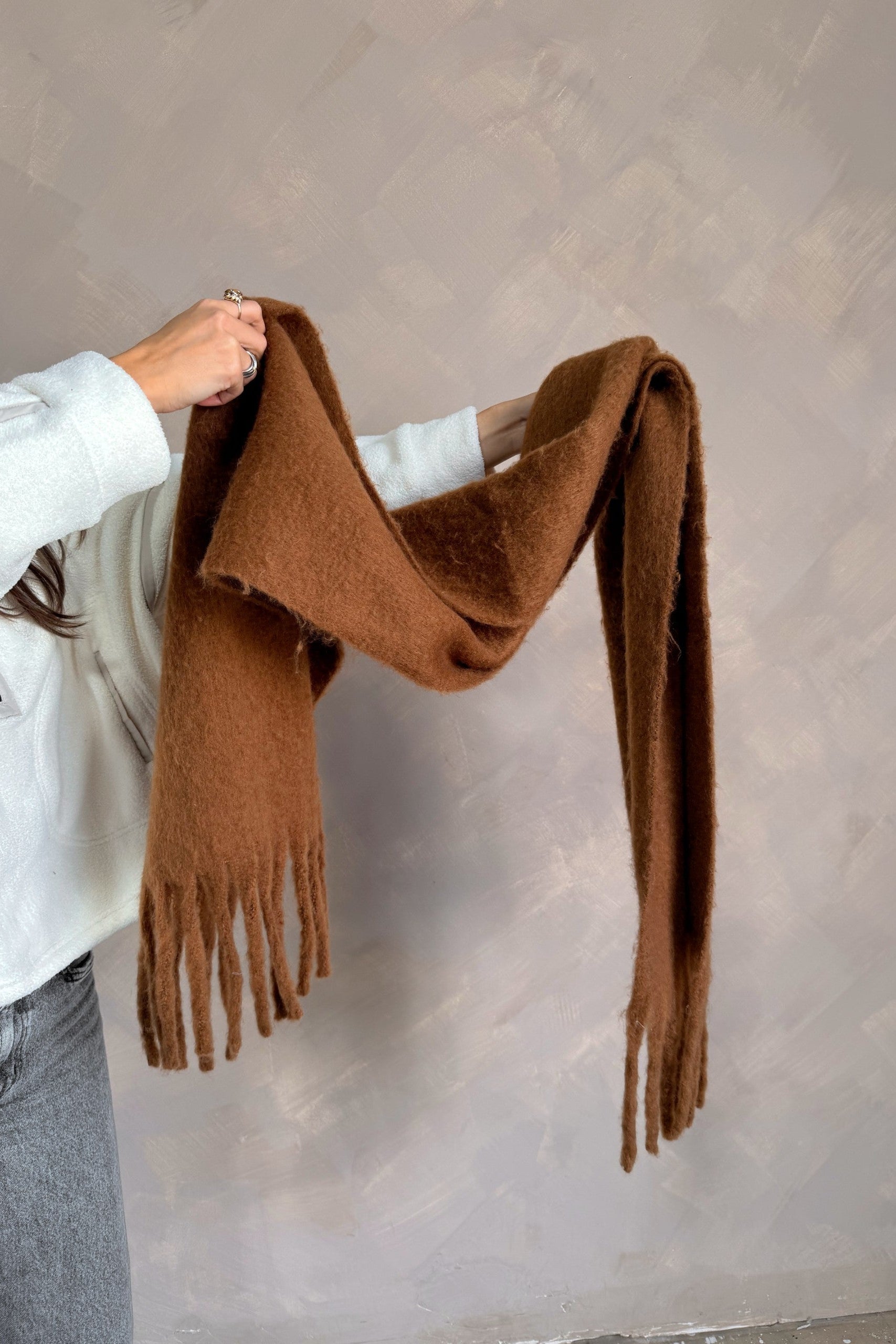 Marlowe Brown Fringe Scarf - held by model