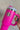 Hand is holding the You Can Do It Tumbler which is a hot pink 40 oz  tumbler featuring a silver "You Can Do It" graphic. Front view.