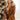 Front view of model wearing the Back To Business Blazer in Brown that has brown faux-leather, a collar and lapel, long sleeves, a two button closure, a faux pocket at the chest, and two large front pockets. Worn over white top.