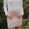 Front view of The All American Skirt In Oatmeal features oatmeal knit fabric, two front pockets, mini length, and back zipper closure.