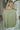 Back view of The Church Bells Ring Top features light green satin fabric, round neckline, button back closure and short sleeves