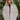 Front view of The Floral Dreams Jacket features cream coloring fabric, flower stitched pattern, two front buttoned chest pockets, cream button up with a collared neckline, two side pockets, and long sleeves with buttoned cuffs.