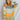 Front view of model wearing the Bright Idea Sweater that has rust, green, sage and mustard stripes, a round neckline, and long sleeves.