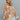 Front view of model wearing the Turn Back Time Top that has cream sheer fabric with mustard and brown pattern details, fabric covered buttons, a collared neckline, and long balloon sleeves with smocked wrists