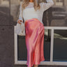 Full body view of model wearing the Brooklyn Coral Satin Midi Skirt which features coral satin fabric, maxi length, elastic band and monochrome side zipper with hook closure.