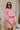 Front view of model wearing the Live Your Best Life Cropped Blazer, which has a pink tweed material, a collar neck, a cuffed long sleeve with a button detail, a button-up front, two front pockets, and a cropped fit