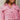 Close-up front view of model wearing the Live Your Best Life Cropped Blazer, which has a pink tweed material, a collar neck, a cuffed long sleeve with a button detail, a button-up front, two front pockets, and a cropped fit