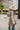 Back view of the Weekend Plans Jacket that features a taupe colored material, a grey and ivory plaid, a collar neck, a long cuffed sleeve, and a button-up front