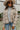 Frontal view of the Weekend Plans Jacket that features a taupe colored material, a grey and ivory plaid, a collar neck, a long cuffed sleeve, and a button-up front