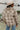 Back view of the Weekend Plans Jacket that features a taupe colored material, a grey and ivory plaid, a collar neck, a long cuffed sleeve, and a button-up front
