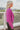 Side view of the Give Me A Beat Cropped Blazer features a purple colored material, a collar and lapel, a front button closure, and long sleeves.